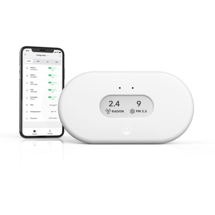 Airthings View Plus indoor air quality monitor with companion mobile app showing radon, PM2.5, CO2 and humidity readings