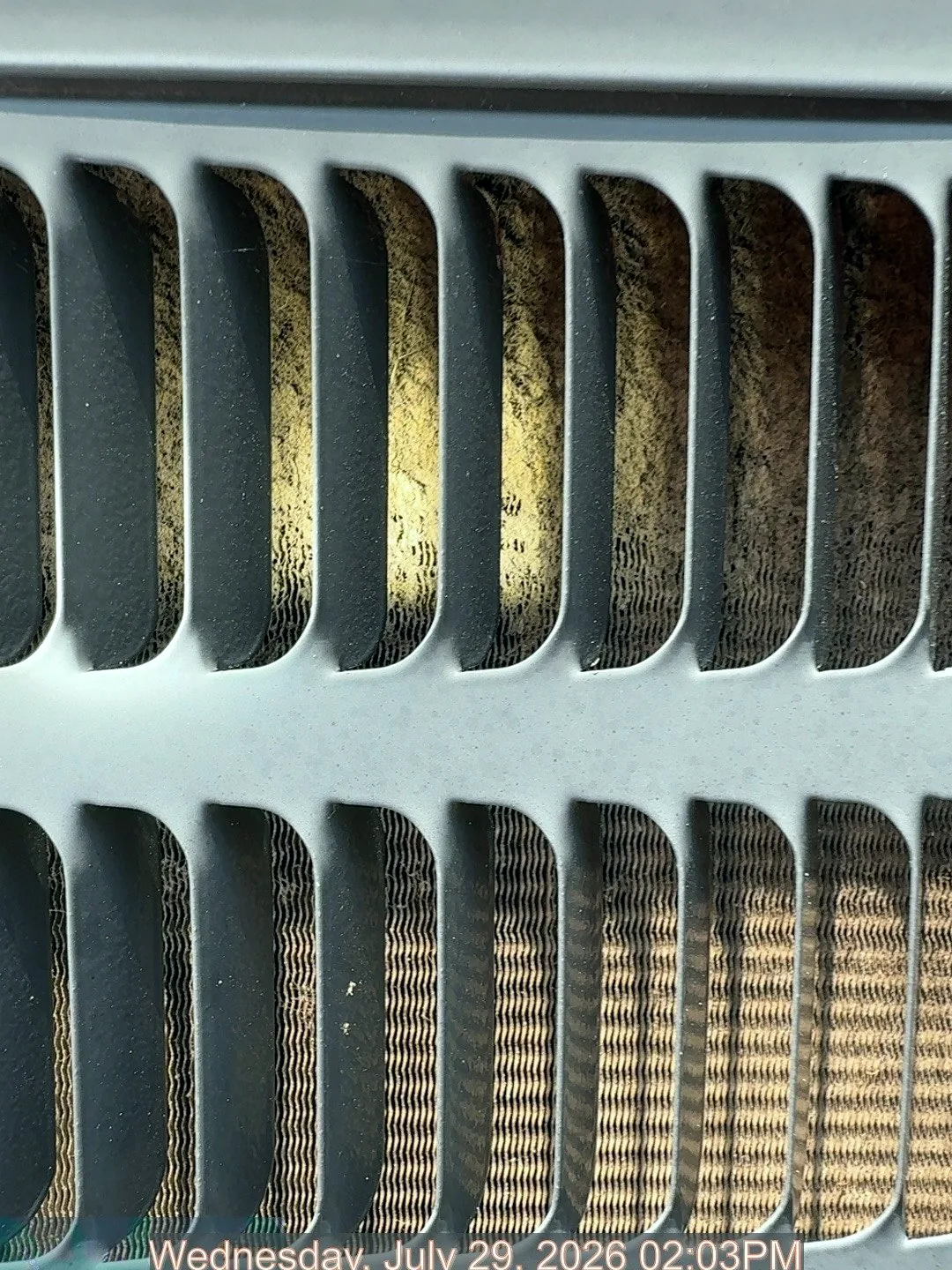 Dirty condenser fins before cleaning