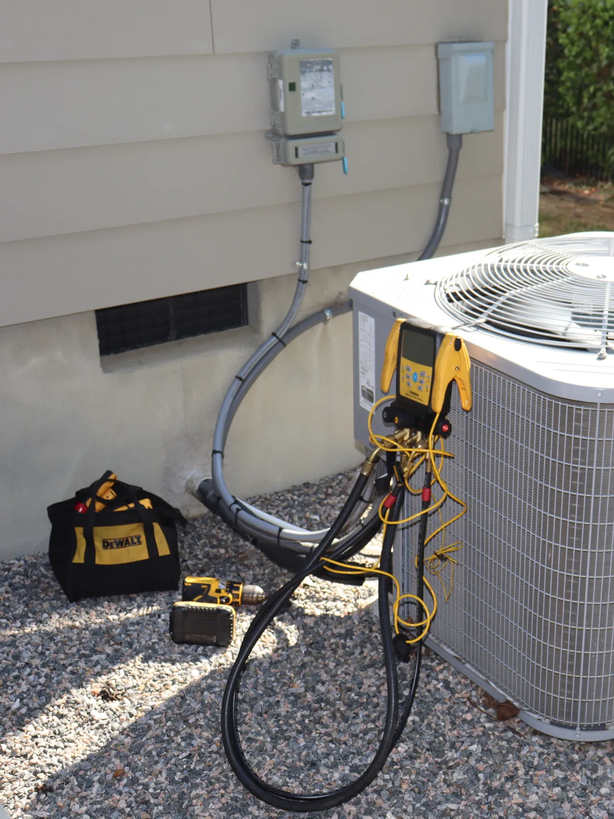 Gauges hooked up for refrigerant readings